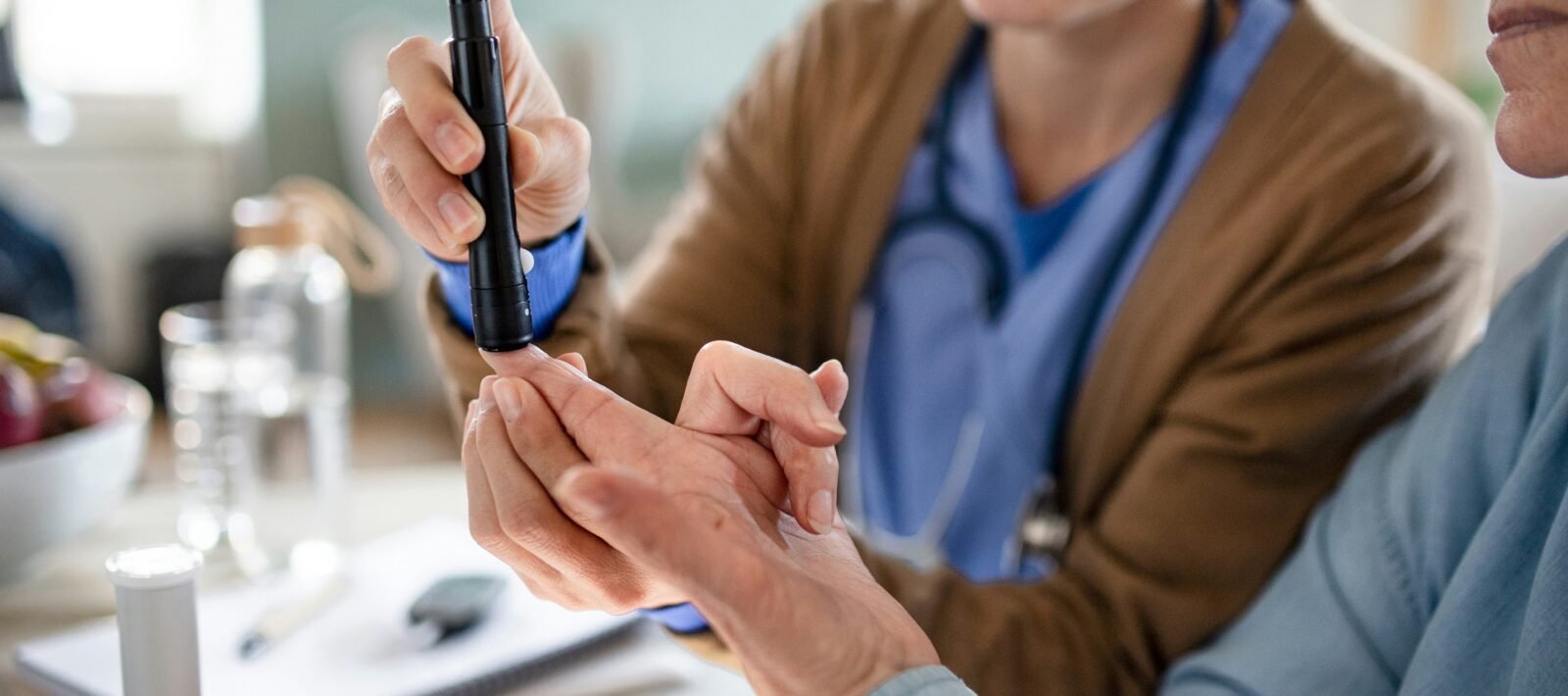 patient checking blood sugar levels