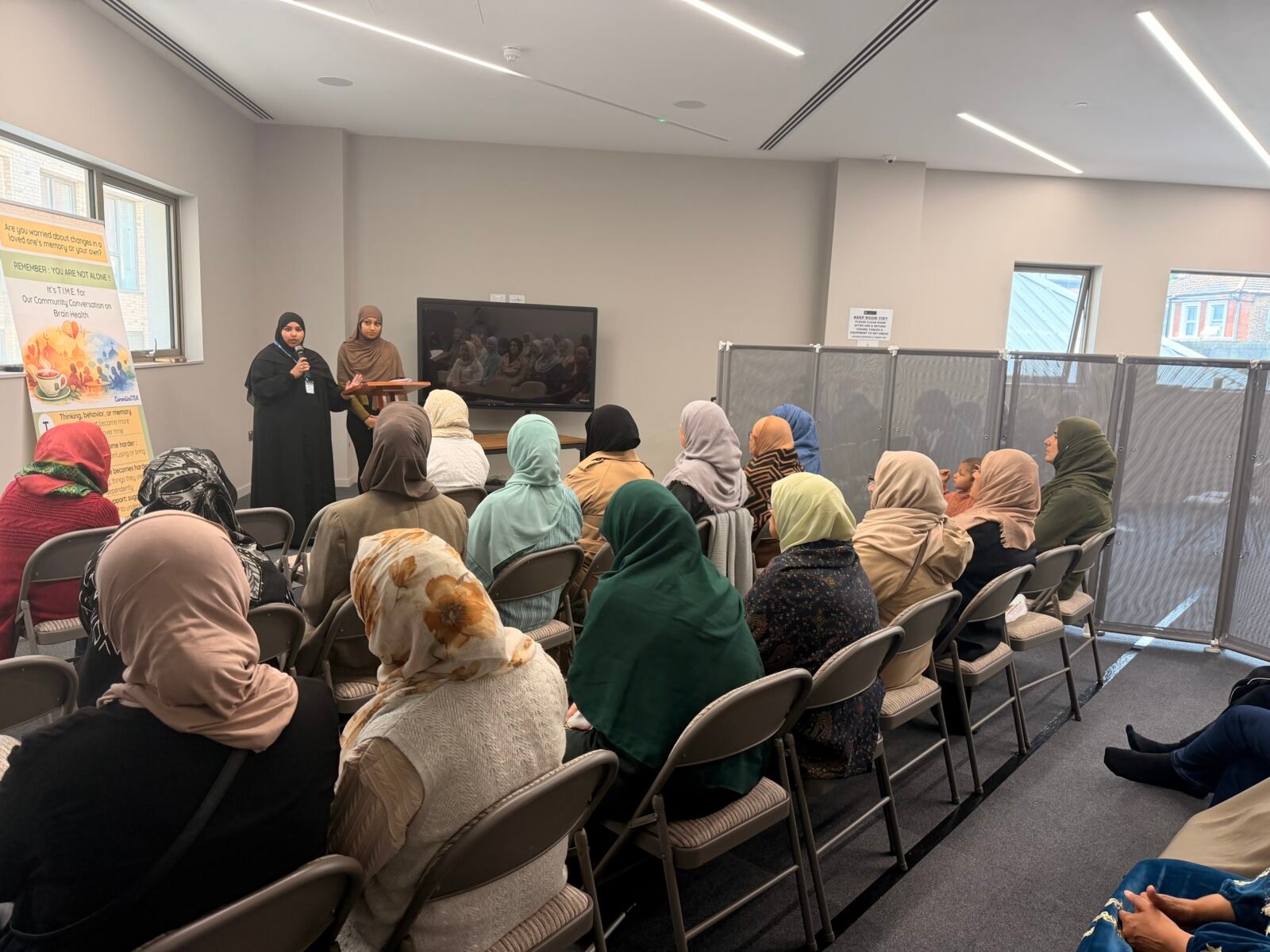 Women listening to presenation at the mosque